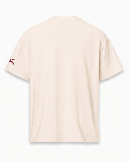 Clean rear studio packshot of GROZAVU SS26 Cream T-Shirt isolated on matching luxury studio cyclorama backdrop