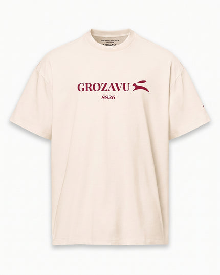 Clean front studio packshot of GROZAVU SS26 Cream T-Shirt isolated on matching luxury studio cyclorama backdrop