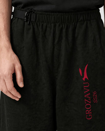 Adjustable waistband detail on the SS26 wide-leg pants
