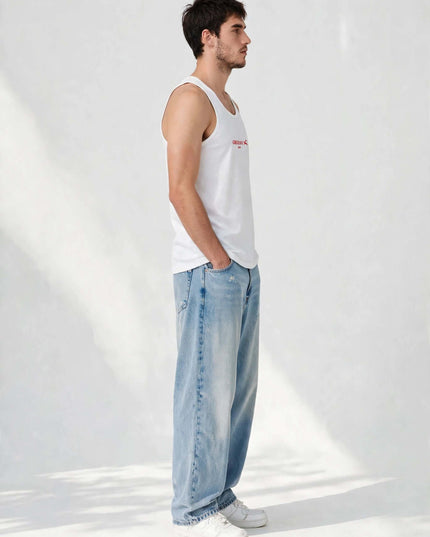Side profile of the white tank top showing its close, non-clinging cut
