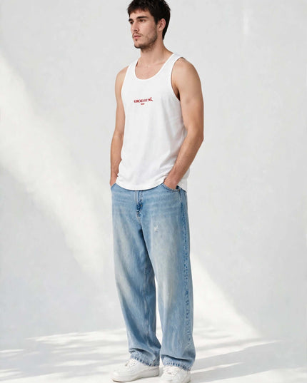 Studio portrait wearing the white 148 g/m² cotton tank top