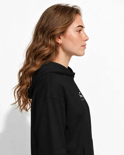 Side profile of the black suede-finish hoodie showing the 2x2 rib