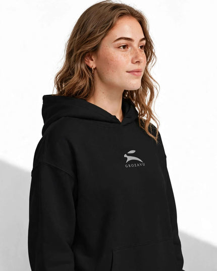 Portrait in the black 350 g/m² suede-finish organic hoodie