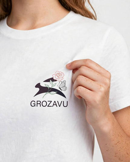 Logo close-up on the White straight-cut cotton tee