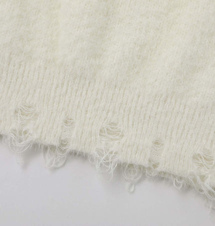 Knit Sweater with Letter Applique showing soft white texture and frayed hem details, ideal for layering in autumn and winter.