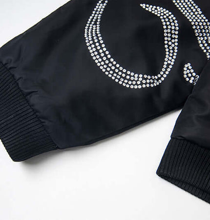 Detail of Hawk Embroidered Letter Hooded Coat showcasing bold embroidered design and sleek fabric texture.