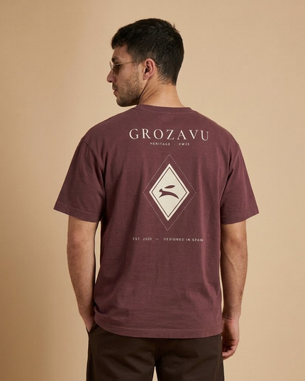Heritage Diamond Tee in washed maroon on a model, back view with the GROZAVU Heritage print