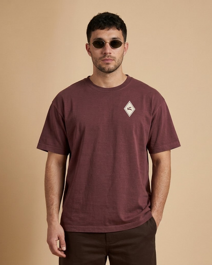 Model wearing the Heritage Diamond Tee in washed maroon, front view with the hare diamond on the chest