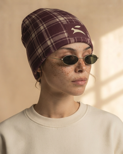 Heritage Tartan Beanie in Bordeaux, three-quarter profile on a model