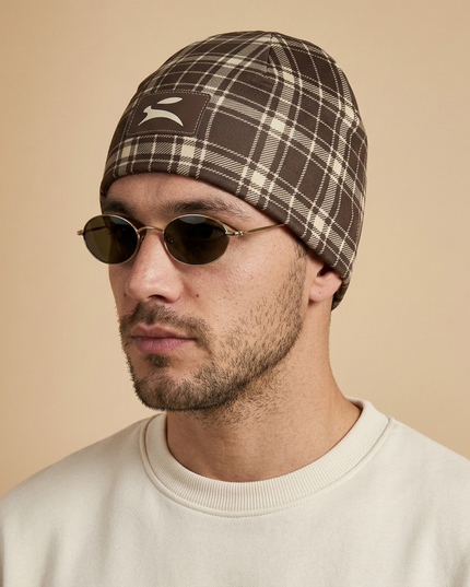 Heritage Tartan Beanie in Cocoa, three-quarter profile on a model