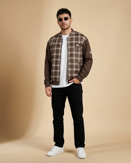 Model wearing the Heritage Tartan Bomber in Cocoa in the studio, full-length front view