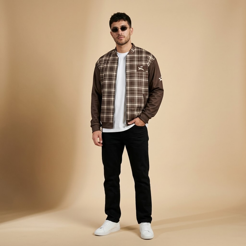 Model wearing the Heritage Tartan Bomber in Cocoa in the studio, full-length front view