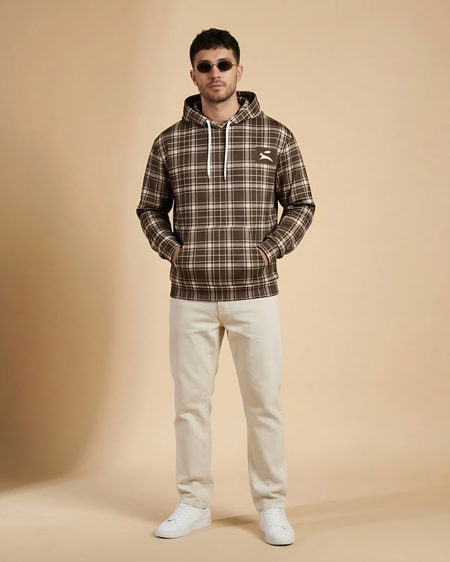 Model wearing the Heritage Tartan Hoodie in Cocoa in the studio, full-length front view
