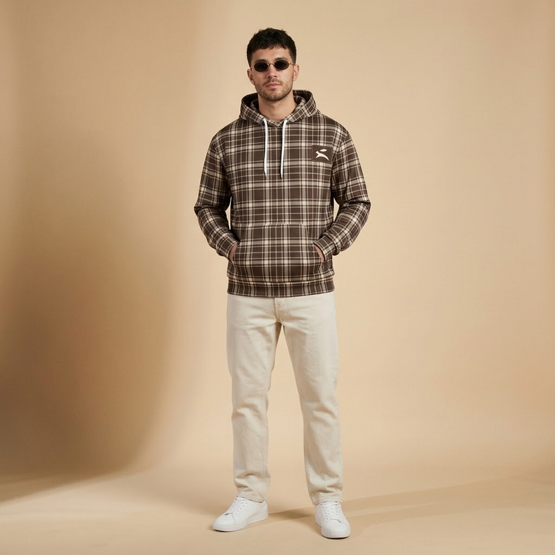 Model wearing the Heritage Tartan Hoodie in Cocoa in the studio, full-length front view