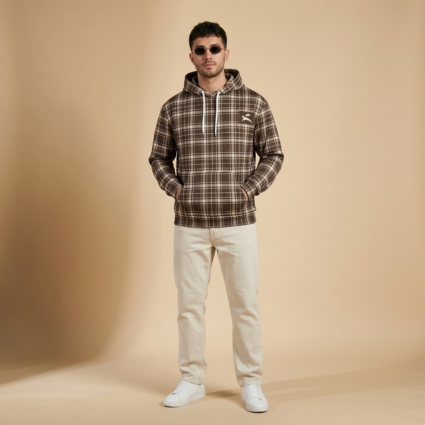 Model wearing the Heritage Tartan Hoodie in Cocoa in the studio, full-length front view