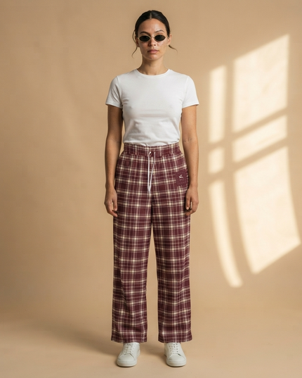 Model wearing the Heritage Tartan Wide-Leg Joggers in Bordeaux, full-length front view