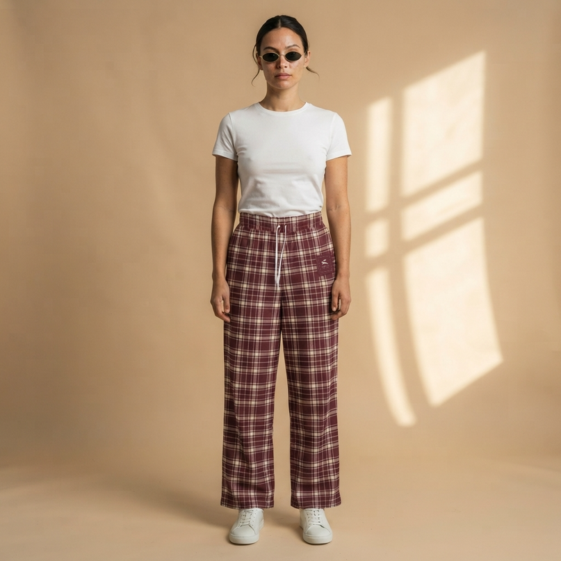 Model wearing the Heritage Tartan Wide-Leg Joggers in Bordeaux, full-length front view