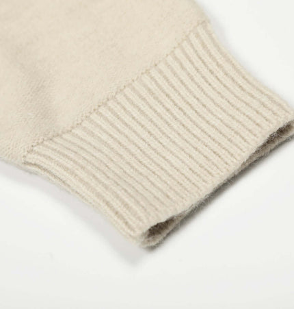 Close-up of the ribbed cuff of the Knit Zipper Sweater Jacket – High Neck, showcasing its soft texture.