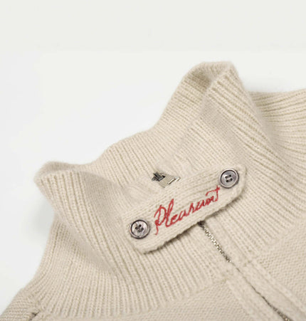 Knit Zipper Sweater Jacket – High Neck collar detail with button and logo in a soft beige color.