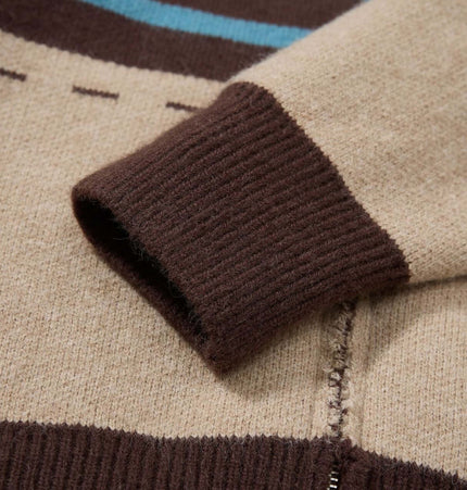 Close-up of the sleeve detail of a High Neck Stripe Jacquard Cardigan showcasing jacquard knitting and cozy fabric.