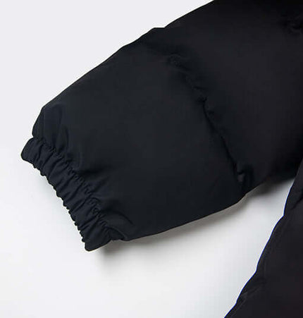 Detail of the sleeve of the Hooded Cotton Puffer Coat – Loose Fit with elastic cuff design.