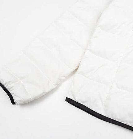 Hooded Quilted Down Jacket showing the quilted sleeve and hem design in white with black accents.