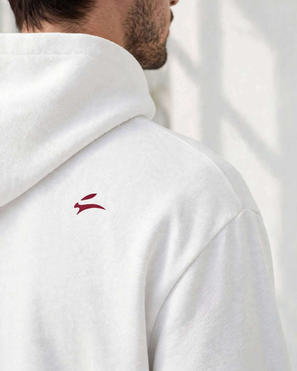 Shoulder seam and fleece detail on the white mill-dyed hoodie