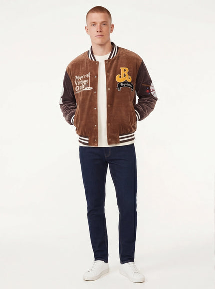 Model wearing Brown baseball jacket , heavy coat by Grozavu