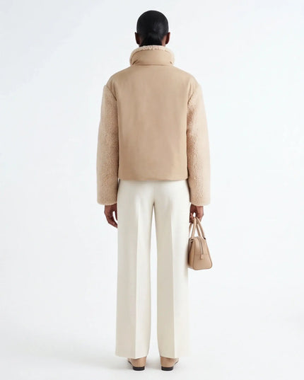 Maison Grozavu Architectural Ivory Top — side profile view showing the shoulder drop and sleeve length