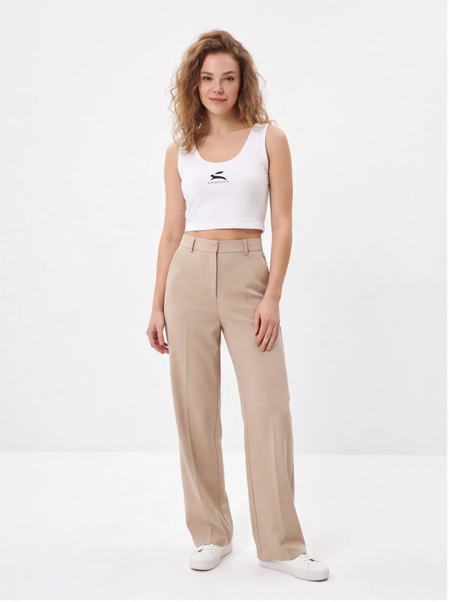 Iron Crop Top Fit — lifestyle shot showing the stretch fabric and how the crop length sits at the waist