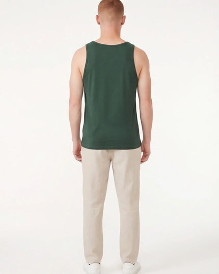 Rear view of the Maison Grozavu Formidable Earth Top in top — showing the tailored hem.