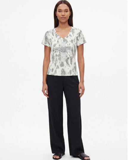 Seamless Quartz Tee — three-quarter view showing the silhouette from the front-left angle in neutral