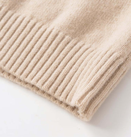 Close-up of the fabric detailing of a Round Neck Casual Knit Sweater in soft beige color.