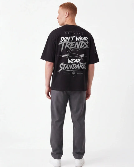 Flint Tee Weave from a three-quarter angle — side view showing the dropped shoulder placement and relaxed body fall