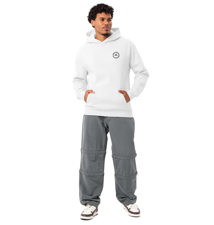 Lane Seven LS16001 I Urban Hoodie in white, styled with grey pants for a modern streetwear look.