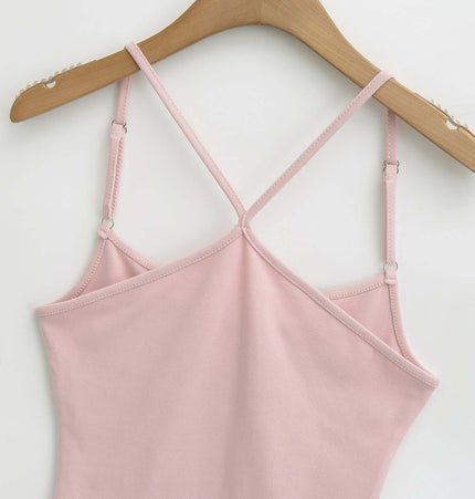 Camisole Style Layered Tank Top in soft pink hanging on a wooden hanger, showcasing its adjustable straps and slim-fit design.