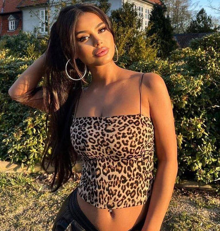 Leopard Print Strapless Crop Tank Top worn by a confident woman in natural outdoor setting.