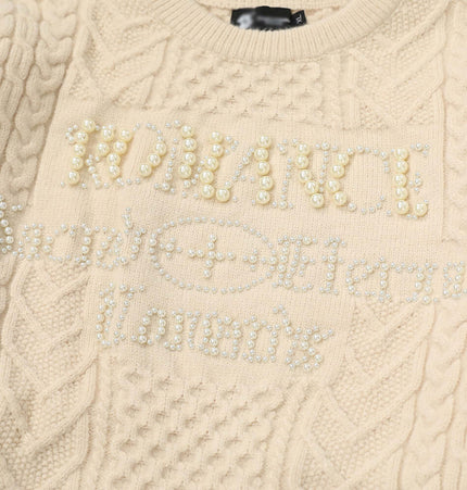 Letter Beaded Knit Sweater – Loose Fit featuring a beaded design on a cream knit fabric.