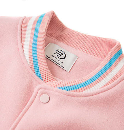 Close-up of the collar and embroidery on the Letter Embroidery Colorblock Jacket in pink.