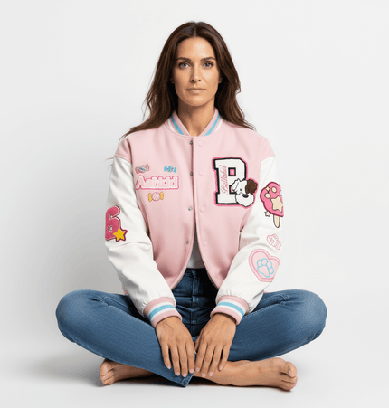 Model wearing a Letter Embroidery Colorblock Jacket with colorful patches, seated on the floor in a casual pose.