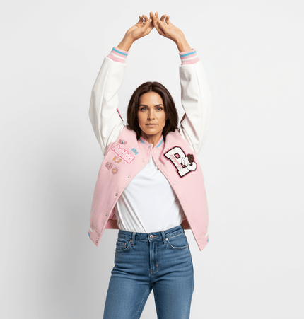 Woman wearing Letter Embroidery Colorblock Jacket, raising arms, showcasing color-blocked design and playful embroidery.