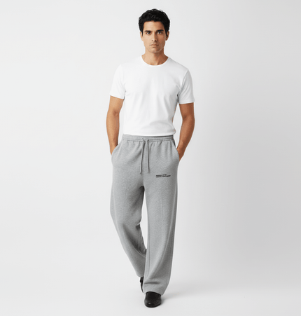 Model wearing Letter Print Casual Pants – Loose Fit with a white t-shirt, showcasing a relaxed and stylish look.