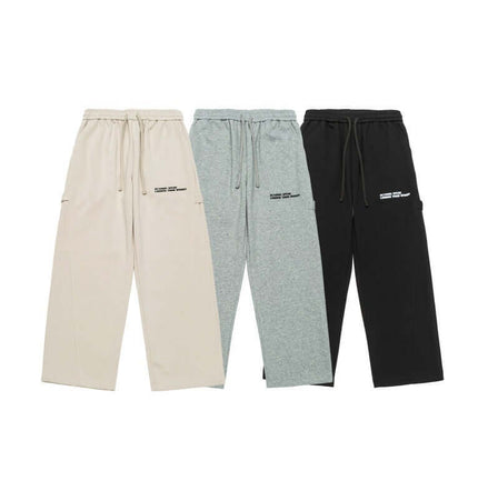 Letter Print Casual Pants – Loose Fit in beige, grey, and black color options, featuring pockets and a relaxed design.
