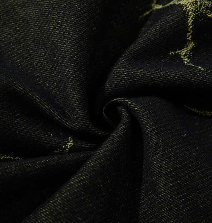 Close-up of Lightning Cargo Wide Leg Denim Pants fabric with lightning pattern design detail.