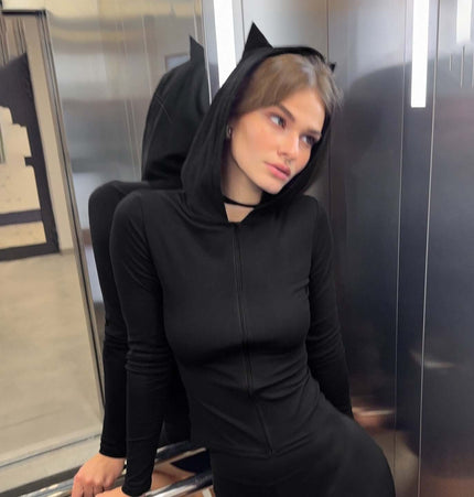 Model wearing Long Sleeve Devil Hooded VNeck TShirt with cat ears in a sleek black color.