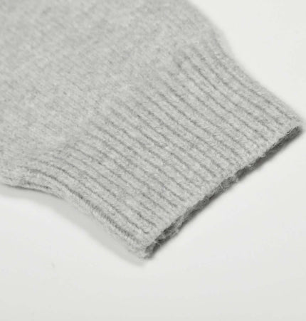 Loose Buttoned Turn Down Collar Sweater sleeve detail showcasing ribbed cuff design.