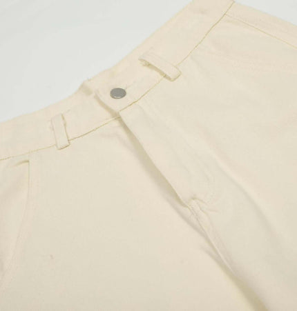 Loose Fit Cartoon Patchwork Pants with playful cartoon embroidery and stylish patchwork design.