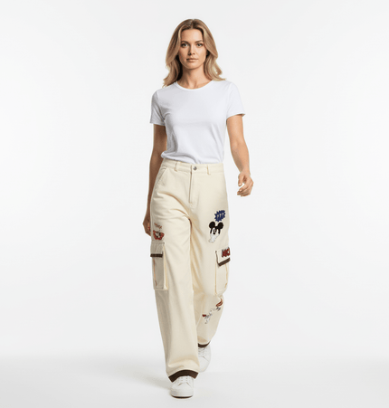 Model wearing Loose Fit Cartoon Patchwork Pants with cartoon embroidery and patchwork details, showcasing playful street fashion.