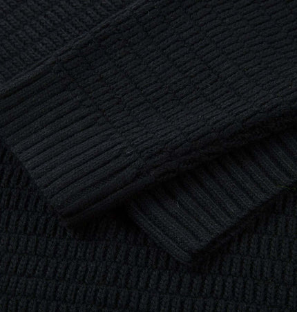 Loose Fit Plain Knit Sweater in textured black fabric with ribbed cuffs for casual streetwear fashion.