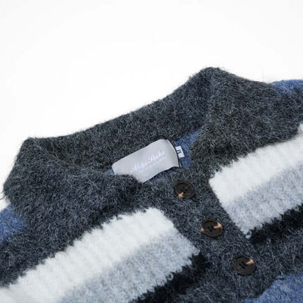 Loose Fit Stripe Polo Neck Sweater showing the flip collar and embroidered stripes in blue shades.